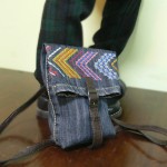 Сумка-рюкзак из старых джинсов, украшенная машинной вышивкой